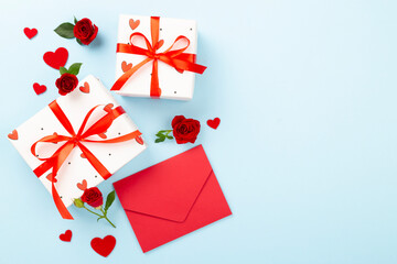 Valentine's Day composition with gifts and red roses on color background, top view
