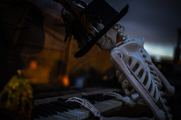 Halloween. Spooky Halloween skeleton with skull and bones in dark background, creepy horror...
