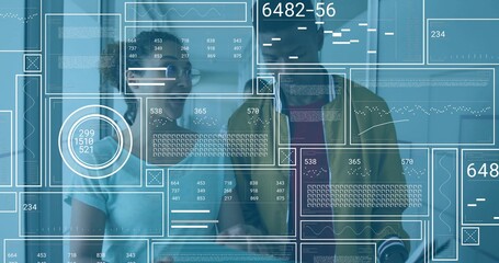 Analyzing team collaborating on transparent digital panels in modern office, with tablet and charts