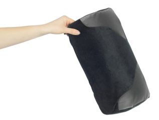 Chair back cushion for posture support in hand, outstretched arm with chair back cushion for posture support, isolated from background