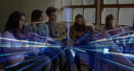 Conductor's baton directing six musicians playing violin, flutes, horn and guitar in studio