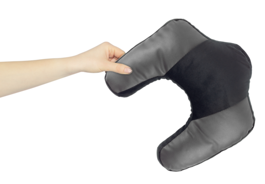 Neck pillow in hand, outstretched arm with neck pillow, isolated from background