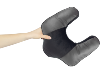 Neck pillow in hand, outstretched arm with neck pillow, isolated from background