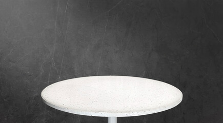 White Terrazzo Round Table Top on dark black marble Background With dramatic lighting. Modern...