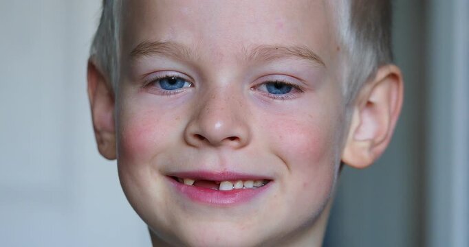 close-up portrait of a boy with blue eyes