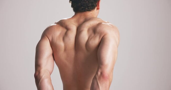 Studio, back and man flex muscle for growth, development and strength with power. Strong, shirtless person and bodybuilder with fitness progress, exercise and physique on white background space