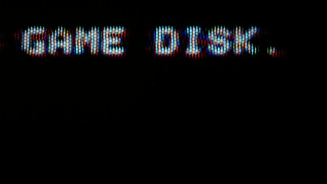 Extreme Close-Up Macro Video of RGB Phosphor Pixels Displaying Game Disk Text on Vintage Cathode Ray Tube Television Screen