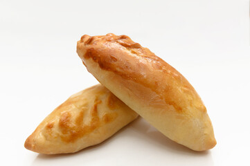 Homemade baked goods. Two pies on a white background. A delicious snack.
