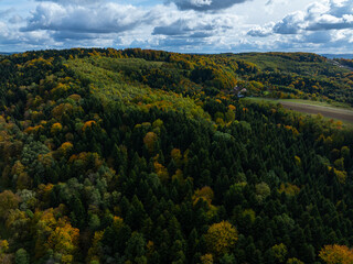 Obraz premium An Artery of Progress: Aerial View of Highway Construction in the Autumn Countryside