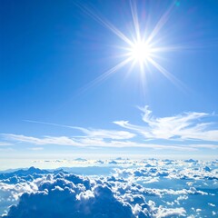 Bright sun shines through a vivid blue sky above a sea of clouds