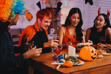 Joyful office Halloween party with coworkers in costumes, celebrating with drinks and laughter, fostering teamwork and festive spirit