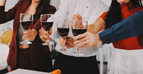 Diversity, dinner and group of people toast celebration together at party. Friends, happy and celebrate with food, wine and friendship for love, support and cheers champagne at business function