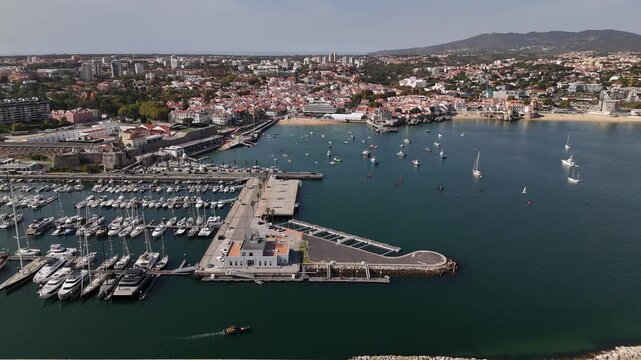 Aerial drone view approaching Cascais, Portugal on a sunny day