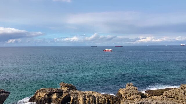 Wonderful view of the calm sea from the promenade in Santander, Spain, with soft waves and a peaceful coastal atmosphere.