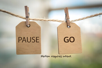 Wooden Tags Displaying Pause and Go on a Strung Rope