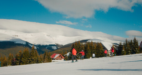 Picturesque view of happy family riding ski in the mountains. Excellent beautiful shot of happy...