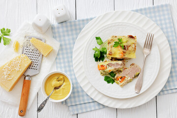 Cheesy ground meat vegetables casserole on a plate