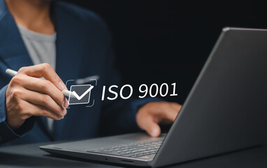 ISO 9001 Standard certification standardisation quality control concept. Person use laptop and choose ISO 9001 on virtual screen for certified and quality management of organizations