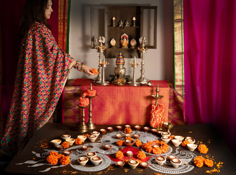 Woman offering a prayer on Diwali 