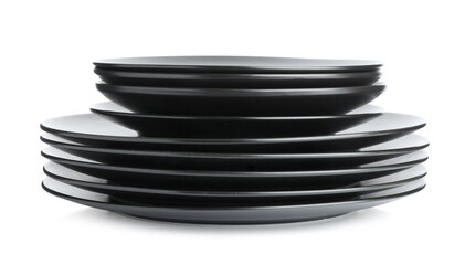Stack of black ceramic plates isolated on white