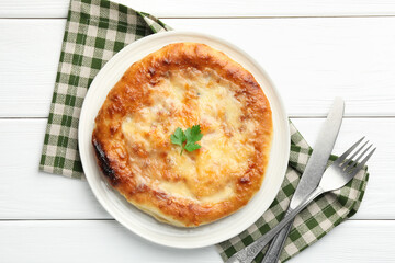 Delicious Megrelian khachapuri served on white wooden table, flat lay