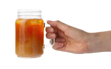 Woman holding mason jar of tasty iced coffee on white background, closeup