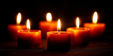 A Serene Display of Flickering Candle Flames Illuminating a Dark Space with Warmth and Tranquility, Creating an Atmosphere of Calmness and Reflection