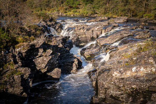 A bright autumnal HDR image of Eas Urchaidh waterfall in Glen Orchy, on its way to Loch Awe, Argyle and Bute, Scotland. 
