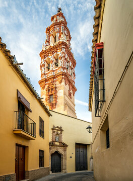 Explore narrow alley showcasing San Juan Bautista Tower in &Eacute;cija