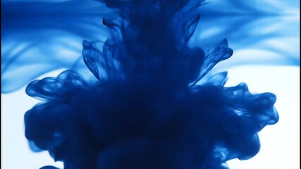 Close-up view of dark blue ink plumes expanding and swirling dynamically as they disperse into translucent water, creating ethereal, flowing shapes against a bright backdrop. - Powered by Adobe