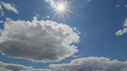 Time-lapse sky with moving clouds and sunburst - Powered by Adobe