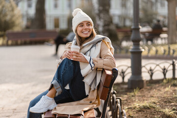 stylish woman walking in winter street