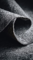 Soft Grey Felt Fabric Texture with Folded Edge Highlighting the Luxurious Feel and Depth of Material in a Captivating Close-Up Composition