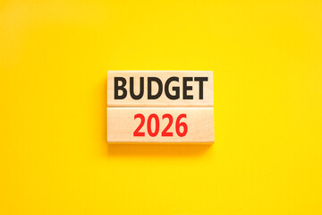 Budget 2026 symbol. Concept words Budget 2026 on beautiful wooden blocks. Beautiful yellow paper background. Business and budget 2026 concept. Copy space.