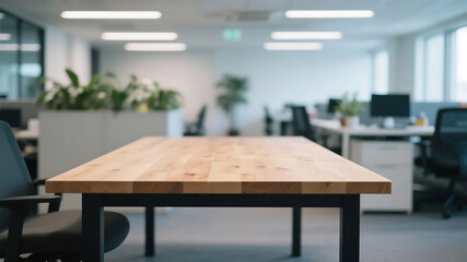 A modern office space featuring a wooden table and multiple workstations with office furniture and plants.