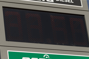 diesel display overview, digital diesel panel in maintenance, closeup of led diesel price display during calibration, technician inspecting green panel of digital diesel price meter after maintenance © Viktar