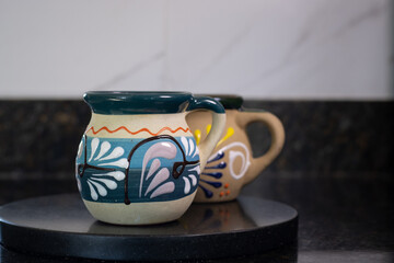 Hand painted traditional mexican jarritos for sipping hot coffee or chocolate
