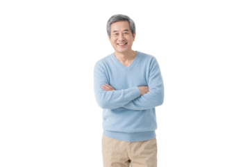 An elderly man in a light blue sweater stands with arms crossed, looking confident and friendly.