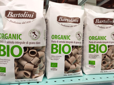Rome, Italy - October 15, 2025: Bartolini organic pasta packages displayed on a supermarket shelf, showcasing whole grain rigatoni with eco-friendly branding and nutritional information