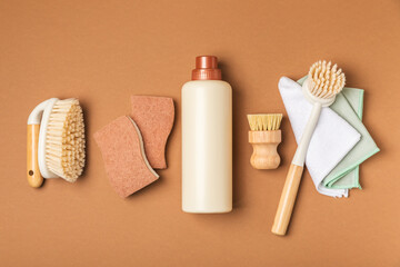 Eco cleaning.Cleaning products on a textured background. Eco-friendly home cleaning. A bottle of natural detergent surfaces, eco brushes, sponges, and rags. Cleaner concept.Cleaning supplies.Flat lay.