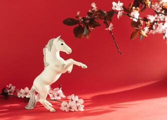 White horse with plum flowers around it, celebration of the Chinese New Year 2026
