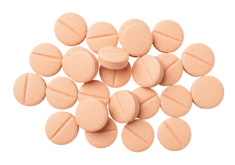 Pile of round peach pills isolated PNG on transparent background, medication tablets for health and pharmaceutical use