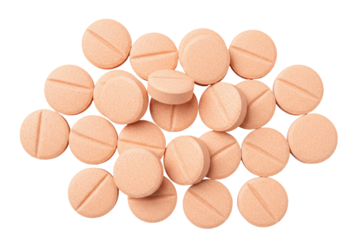Pile of round peach pills isolated PNG on transparent background, medication tablets for health and pharmaceutical use
