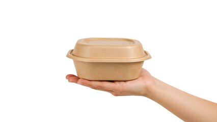 Hand holding a brown kraft paper food bowl with a lid, takeaway container. Isolated on transparent background, png
