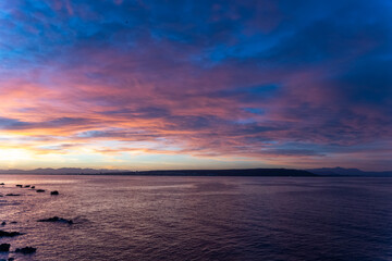 Dazzling sunset from Tabarca Island with Santa Pola in front in Alicante, Spain