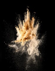Explosion of light-brown powder against black background