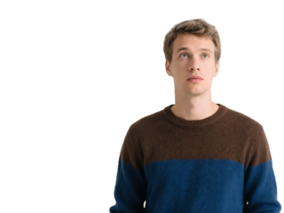 A young man in a two - toned sweater is looking upwards, showcasing a casual and simple appearance.