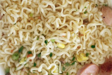 Noodles with spicy sauce and green onion chopped parts