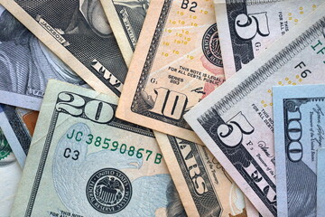 Big amount of different dollar bills close up. Hundred fifty twenty ten and five dollar banknotes