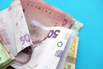 Big amount of different Ukrainian hryvnia money bills. Pile of crumpled ukrainian banknotes